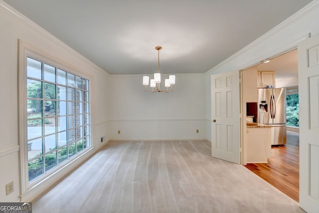 5507 Martina Way, Dunwoody, GA 30338 - unfurnished dining area featuring healthy amount of natural light, a chandelier, ornamental molding, and baseboards