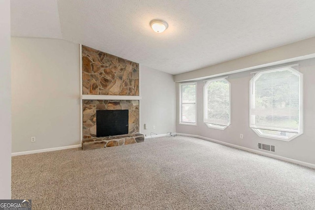 2218 Lowtrail Ct, Lithonia, GA 30058 - unfurnished living room featuring carpet, lofted ceiling, a textured ceiling, and baseboards