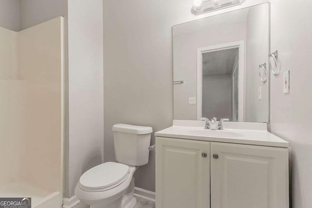 2218 Lowtrail Ct, Lithonia, GA 30058 - full bath with toilet, vanity, a shower, and baseboards