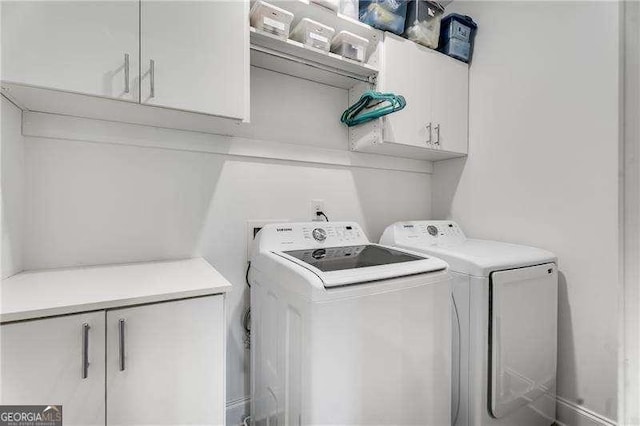 6635 Beacon Dr, Atlanta, GA 30328 - laundry area featuring cabinet space and washer and clothes dryer