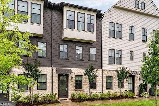 6635 Beacon Dr, Atlanta, GA 30328 - view of property with brick siding