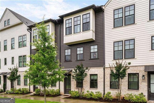 6635 Beacon Dr, Atlanta, GA 30328 - townhome / multi-family property featuring brick siding