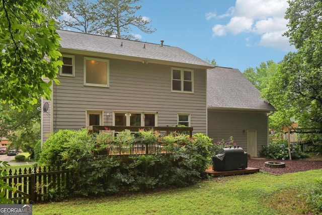 1369 Willowbrook Dr SW, Marietta, GA 30064 - rear view of house featuring a deck and roof with shingles