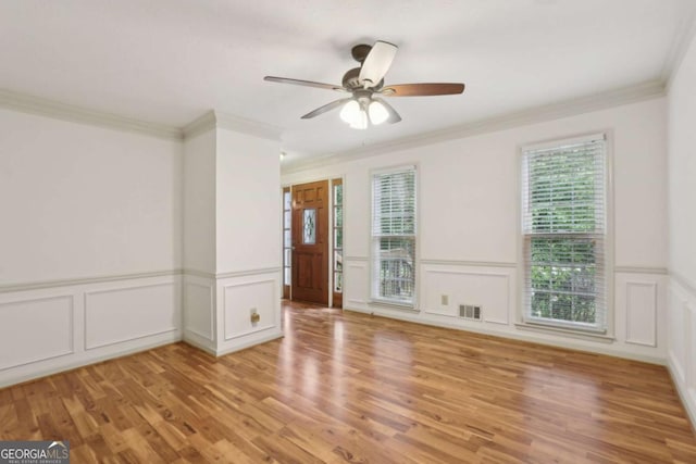 1369 Willowbrook Dr SW, Marietta, GA 30064 - unfurnished room with a decorative wall, plenty of natural light, light wood finished floors, ornamental molding, and a ceiling fan