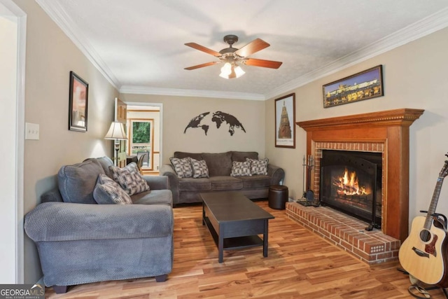 1369 Willowbrook Dr SW, Marietta, GA 30064 - living area with light wood-style floors, ornamental molding, a fireplace, and ceiling fan