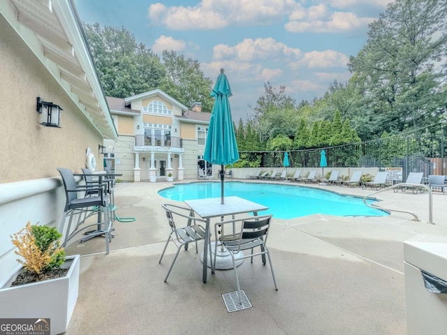 2700 Pine Tree Rd NE Unit 1013, Atlanta, GA 30324 - community pool with a patio and view of scattered trees