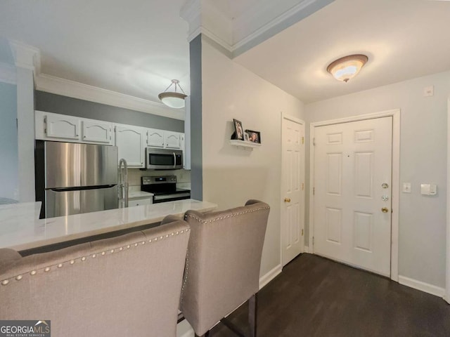 2700 Pine Tree Rd NE Unit 1013, Atlanta, GA 30324 - foyer with dark wood-style flooring and crown molding