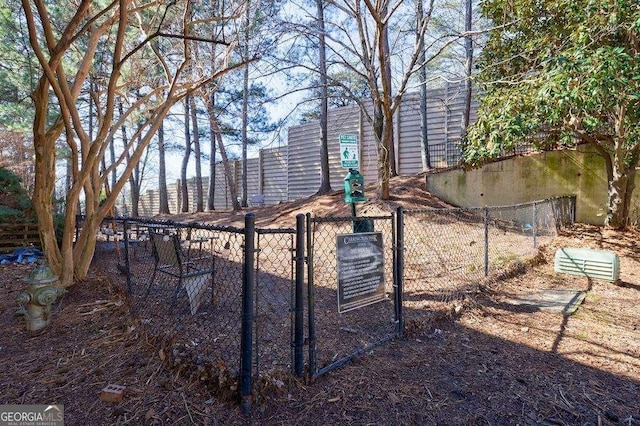 2700 Pine Tree Rd NE Unit 1013, Atlanta, GA 30324 - view of yard with a gate