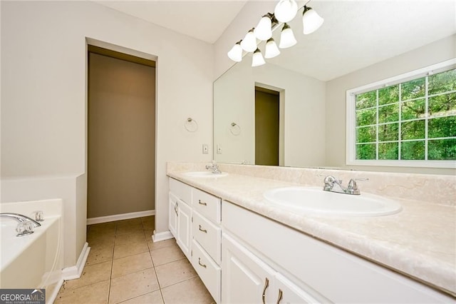 85 Chestnut Dr, Covington, GA 30016 - full bath featuring double vanity, tile patterned floors, a bath, and baseboards