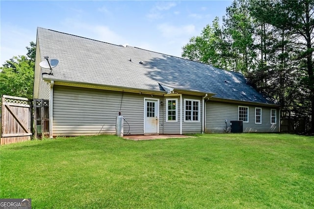 85 Chestnut Dr, Covington, GA 30016 - rear view of house featuring roof with shingles