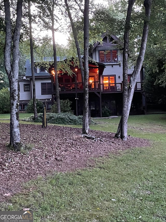 1361 Grayson Pointe Dr, Buckhead, GA 30625 - rear view of house featuring a lawn and a wooden deck
