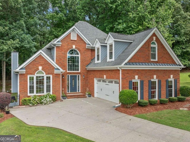 1440 Boundary Blvd, Suwanee, GA 30024 - view of front of house with brick siding, concrete driveway, a shingled roof, and a garage