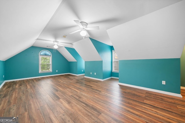 1440 Boundary Blvd, Suwanee, GA 30024 - bonus room featuring ceiling fan, wood finished floors, baseboards, and lofted ceiling