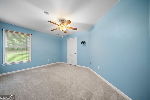 1440 Boundary Blvd, Suwanee, GA 30024 - carpeted spare room with a ceiling fan and baseboards
