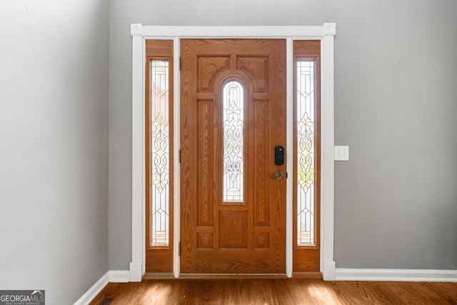 1440 Boundary Blvd, Suwanee, GA 30024 - entrance foyer featuring baseboards and wood finished floors