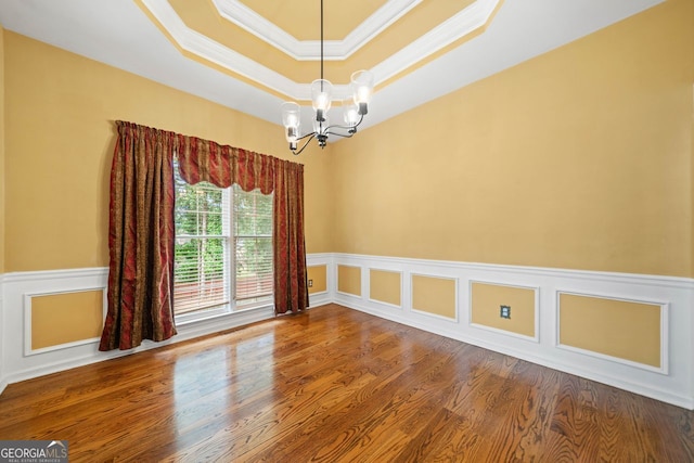 1440 Boundary Blvd, Suwanee, GA 30024 - unfurnished room featuring ornamental molding, a chandelier, wood finished floors, and a raised ceiling