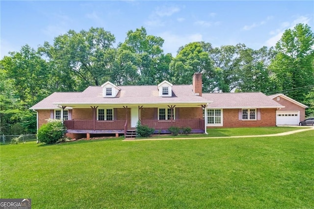 263 Austin Rd, Stockbridge, GA 30281 - view of front of home with a chimney, covered porch, brick siding, and a garage