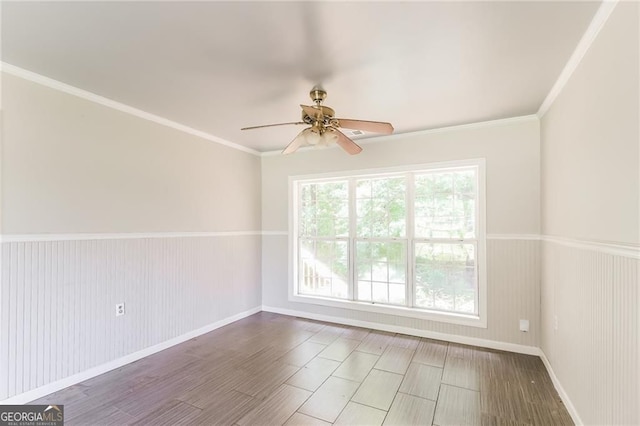 263 Austin Rd, Stockbridge, GA 30281 - spare room featuring ceiling fan, a wainscoted wall, and ornamental molding