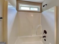 473 Cherry Creek Dr, Loganville, GA 30052 - full bathroom with washtub / shower combination