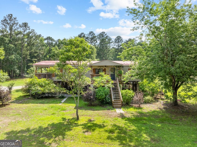 67 Lagoon Rd, Statesboro, GA 30461 - view of grassy yard featuring stairway and a porch
