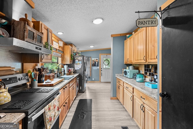 67 Lagoon Rd, Statesboro, GA 30461 - kitchen featuring range, white microwave, light countertops, under cabinet range hood, and a textured ceiling