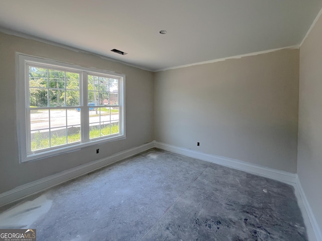 281 Gordon St, Statesboro, GA 30458 - empty room featuring baseboards, crown molding, and concrete flooring