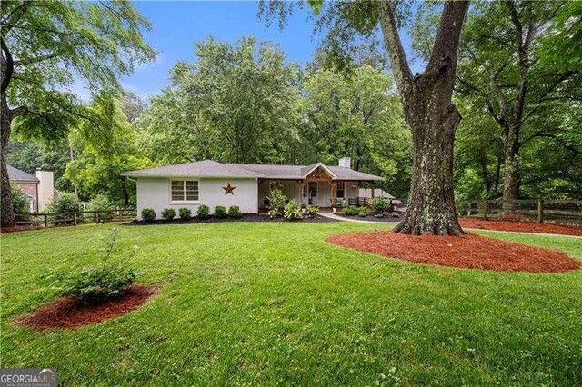 2020 New Kemp Rd, Marietta, GA 30066 - view of front of home with a chimney, stucco siding, and covered porch