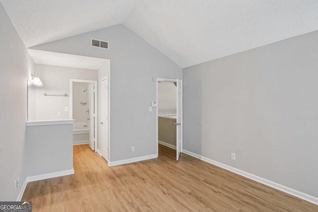 484 Culberson St SW, Atlanta, GA 30310 - unfurnished bedroom featuring wood finished floors, vaulted ceiling, and ensuite bathroom