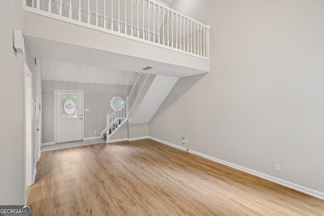 484 Culberson St SW, Atlanta, GA 30310 - foyer featuring wood finished floors, stairs, and a towering ceiling