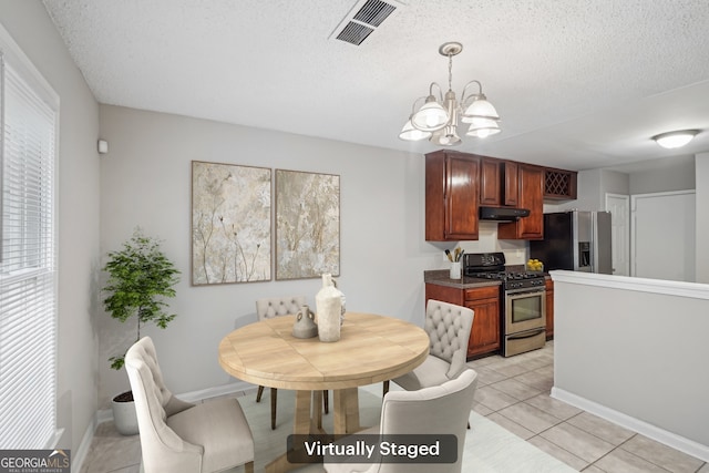 484 Culberson St SW, Atlanta, GA 30310 - dining room with a chandelier, a textured ceiling, and light tile patterned floors