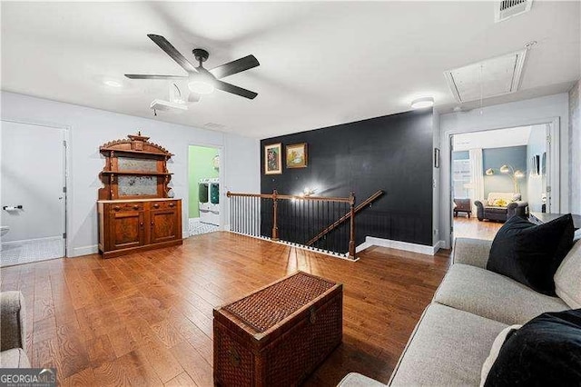 2069 Brightleaf Way Unit 123, Marietta, GA 30060 - living area with attic access, wood finished floors, ceiling fan, and baseboards