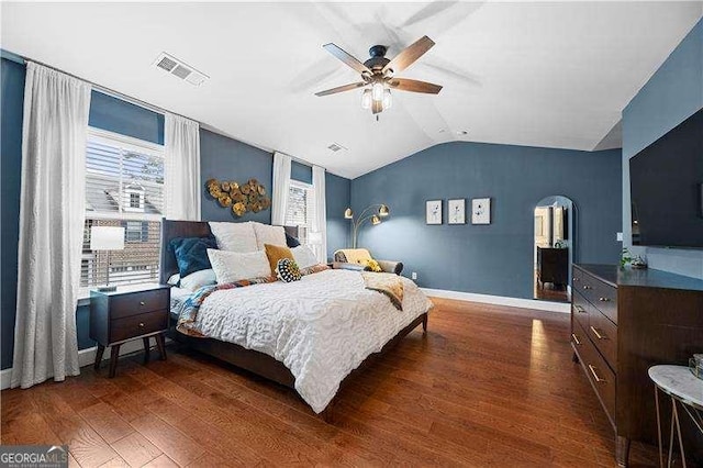2069 Brightleaf Way Unit 123, Marietta, GA 30060 - bedroom featuring wood finished floors, arched walkways, multiple windows, lofted ceiling, and baseboards