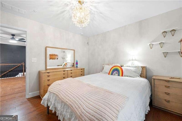 2069 Brightleaf Way Unit 123, Marietta, GA 30060 - bedroom with wood-type flooring and a chandelier