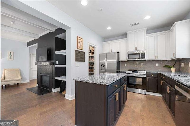 2069 Brightleaf Way Unit 123, Marietta, GA 30060 - kitchen featuring appliances with stainless steel finishes, white cabinetry, dark wood-style flooring, backsplash, and recessed lighting