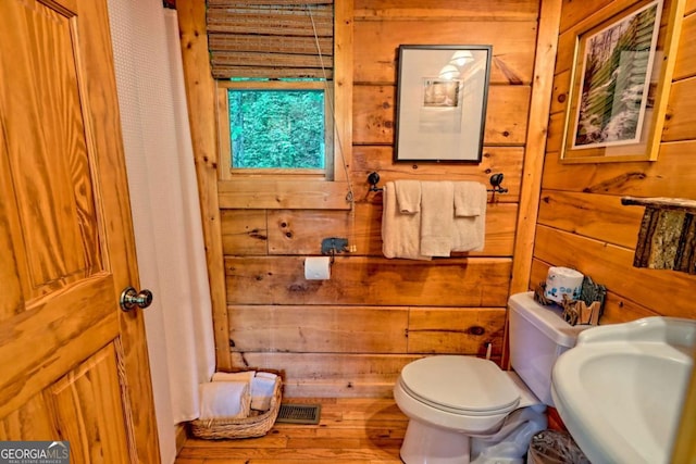 481 Georgianna Ln, Bryson City, NC 28713 - bathroom featuring toilet, wood walls, wood finished floors, and a sink