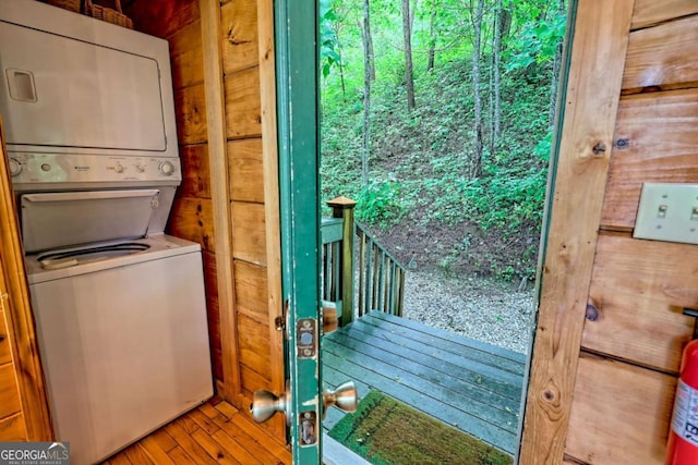 481 Georgianna Ln, Bryson City, NC 28713 - laundry room with stacked washer / dryer and wood finished floors