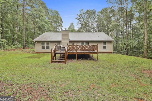 279 Brenna Ct, Luthersville, GA 30251 - back of property featuring a deck, a chimney, and a lawn