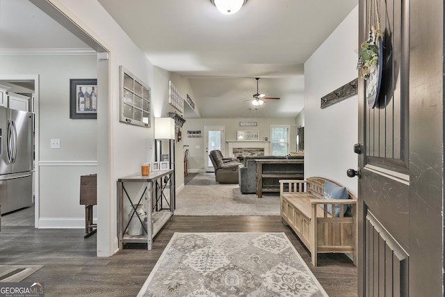 279 Brenna Ct, Luthersville, GA 30251 - foyer featuring ceiling fan, a fireplace, baseboards, dark wood-style flooring, and vaulted ceiling