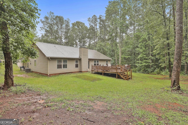 279 Brenna Ct, Luthersville, GA 30251 - rear view of house with a deck, a chimney, a yard, and central AC unit