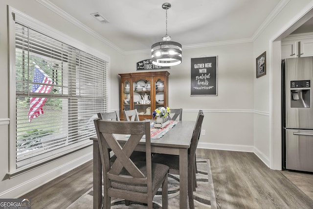 279 Brenna Ct, Luthersville, GA 30251 - dining space with wood finished floors, crown molding, a chandelier, and baseboards