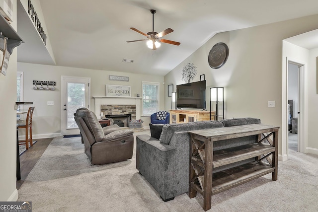279 Brenna Ct, Luthersville, GA 30251 - carpeted living area featuring ceiling fan, a stone fireplace, lofted ceiling, and baseboards
