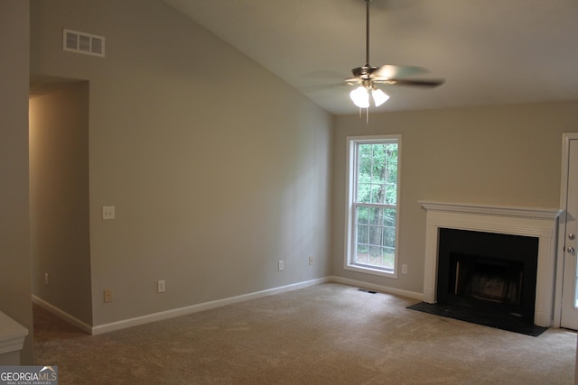 1408 Wyndham Way, Bethlehem, GA 30620 - unfurnished living room featuring carpet flooring, ceiling fan, baseboards, vaulted ceiling, and a fireplace with flush hearth