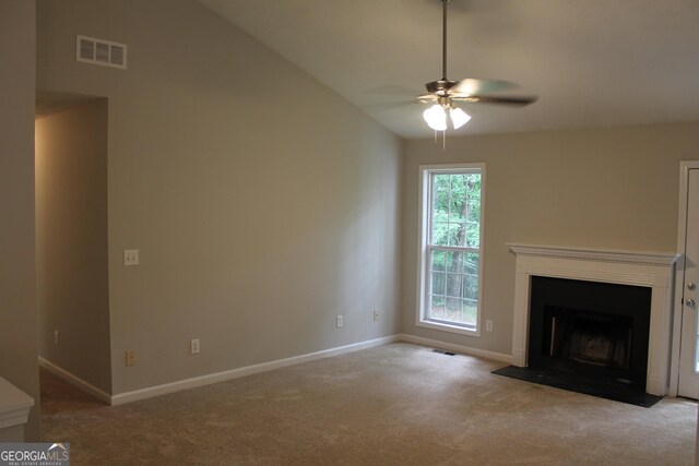 1408 Wyndham Way, Bethlehem, GA 30620 - unfurnished living room with carpet flooring, a ceiling fan, lofted ceiling, and a fireplace with flush hearth
