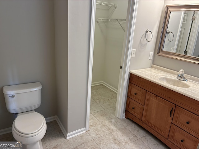 1408 Wyndham Way, Bethlehem, GA 30620 - bathroom with vanity, tile patterned floors, and a spacious closet