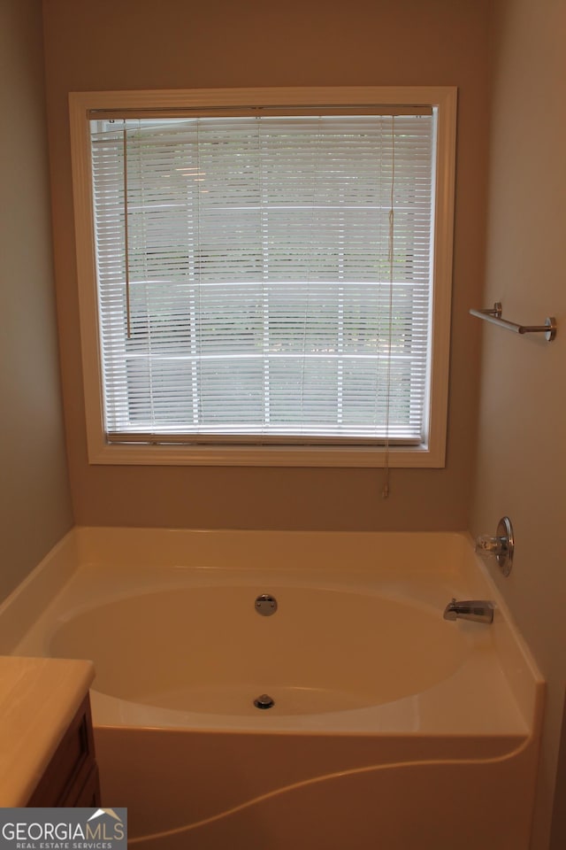1408 Wyndham Way, Bethlehem, GA 30620 - full bathroom with plenty of natural light, a garden tub, and vanity
