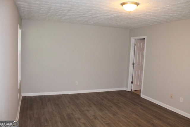1408 Wyndham Way, Bethlehem, GA 30620 - unfurnished room featuring dark wood-type flooring and a textured ceiling