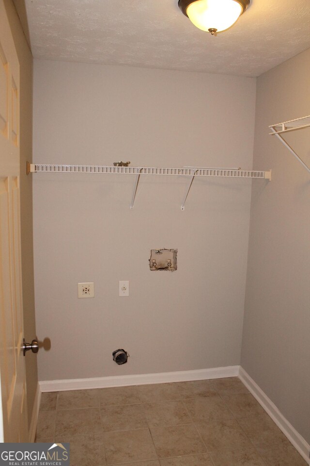 1408 Wyndham Way, Bethlehem, GA 30620 - laundry area with hookup for a washing machine and tile patterned flooring