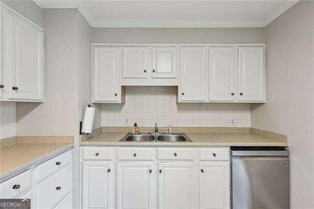 3351 Landrum Dr SE, Smyrna, GA 30082 - kitchen featuring stainless steel dishwasher, a sink, white cabinets, light countertops, and tasteful backsplash