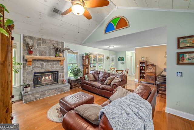 1526 Oakleaf Dr, Auburn, GA 30011 - living room featuring wood finished floors, ceiling fan, a stone fireplace, baseboards, and wood ceiling