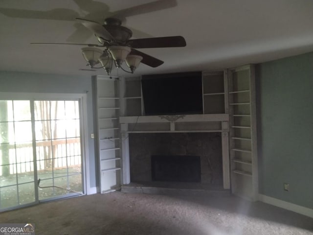 390 Burg Rd, Locust Grove, GA 30248 - unfurnished living room featuring a fireplace with raised hearth, ceiling fan, and baseboards